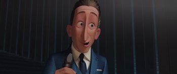 Movie still from “Incredibles 2” (2018), directed by Brad Bird – An animated man in a blue suit holding a microphone; Close Up shot, Low angle