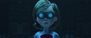 Movie still from “Incredibles 2” (2018), directed by Brad Bird – A woman wearing a silver suit and goggles; Close Up shot, Over the shoulder angle