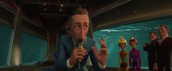 Movie still from “Incredibles 2” (2018), directed by Brad Bird – An animated man in a blue suit is holding a key; Medium shot, Over the shoulder angle