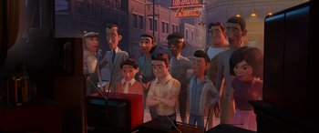 Movie still from “Incredibles 2” (2018), directed by Brad Bird – A group of people standing next to each other in front of a television; Wide shot, High angle