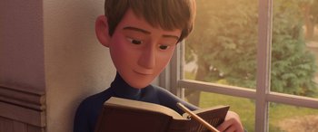 Movie still from “Incredibles 2” (2018), directed by Brad Bird – A boy is reading a book by a window; Close Up shot, High angle