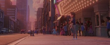 Movie still from “Incredibles 2” (2018), directed by Brad Bird – A group of people standing on the side of a road; Wide shot, Over the shoulder angle