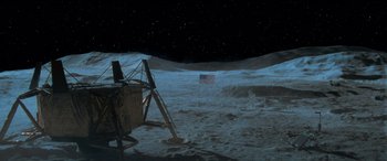 Movie still from “Independence Day” (1996), directed by Roland Emmerich – An american flag on the surface of the moon at night; Extreme Wide shot, High angle