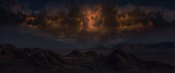 Movie still from “Independence Day” (1996), directed by Roland Emmerich – A dark cloudy sky over a field with cows grazing; Extreme Wide shot, High angle