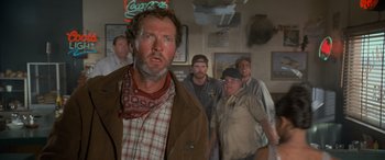 Movie still from “Independence Day” (1996), directed by Roland Emmerich – A group of men standing in a room; Close Up shot, Low angle