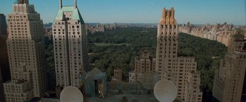 Movie still from “Independence Day” (1996), directed by Roland Emmerich – An aerial view of a large city with many trees; Extreme Wide shot, High angle