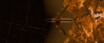 Movie still from “Independence Day” (1996), directed by Roland Emmerich – An airplane is flying through the night sky; Extreme Wide shot, Overhead angle