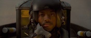 Movie still from “Independence Day” (1996), directed by Roland Emmerich – A person wearing a pilot's helmet; Close Up shot, Low angle