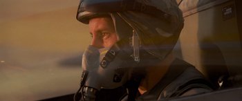 Movie still from “Independence Day” (1996), directed by Roland Emmerich – A man wearing a gas mask in the sun; Close Up shot, Low angle