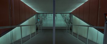 Movie still from “Independence Day” (1996), directed by Roland Emmerich – People are walking down a ramp in a building; Extreme Wide shot, High angle