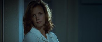 Movie still from “Independence Day” (1996), directed by Roland Emmerich – A person wearing a white shirt; Close Up shot, Over the shoulder angle