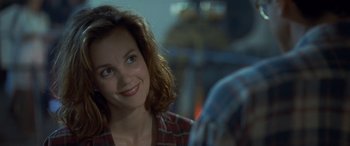 Movie still from “Independence Day” (1996), directed by Roland Emmerich – A person sitting at a table; Close Up shot, Over the shoulder angle