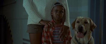 Movie still from “Independence Day” (1996), directed by Roland Emmerich – A young boy with a hat on his head; Close Up shot, Over the shoulder angle