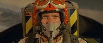 Movie still from “Independence Day” (1996), directed by Roland Emmerich – A person wearing a pilot's helmet; Close Up shot, Low angle