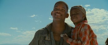 Movie still from “Independence Day” (1996), directed by Roland Emmerich – A man and a boy smiling for the camera; Close Up shot, Low angle