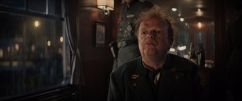 Movie still from “Indiana Jones and the Dial of Destiny” (2023), directed by James Mangold – A man in a military uniform looking at the camera; Close Up shot, Low angle