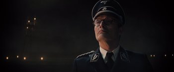 Movie still from “Indiana Jones and the Dial of Destiny” (2023), directed by James Mangold – A man in a military uniform is looking up; Close Up shot, Low angle