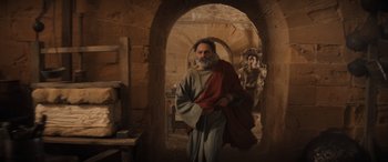 Movie still from “Indiana Jones and the Dial of Destiny” (2023), directed by James Mangold – An old man and a young woman in a room; Wide shot, Low angle