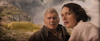 Movie still from “Indiana Jones and the Dial of Destiny” (2023), directed by James Mangold – A man and a woman standing next to each other; Close Up shot, Low angle