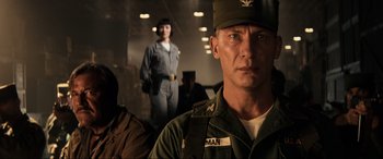 Movie still from “Indiana Jones and the Kingdom of the Crystal Skull” (2008), directed by Steven Spielberg – A man in a military uniform standing in front of a woman; Close Up shot, Low angle