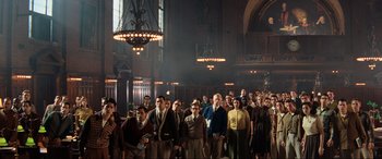Movie still from “Indiana Jones and the Kingdom of the Crystal Skull” (2008), directed by Steven Spielberg – A group of people standing in front of a large chandelier; Wide shot, High angle
