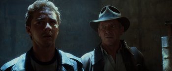 Movie still from “Indiana Jones and the Kingdom of the Crystal Skull” (2008), directed by Steven Spielberg – A man and an older man wearing a hat; Close Up shot, Low angle