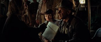 Movie still from “Indiana Jones and the Kingdom of the Crystal Skull” (2008), directed by Steven Spielberg – A man and a woman looking at something in a box; Close Up shot, Over the shoulder angle