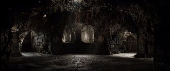 Movie still from “Indiana Jones and the Kingdom of the Crystal Skull” (2008), directed by Steven Spielberg – A dark room with a tree hanging from the ceiling; Extreme Wide shot, High angle
