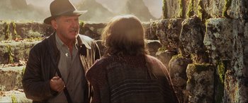 Movie still from “Indiana Jones and the Kingdom of the Crystal Skull” (2008), directed by Steven Spielberg – A man and a woman standing next to each other on a cliff; Medium shot, Over the shoulder angle