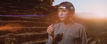 Movie still from “Indiana Jones and the Kingdom of the Crystal Skull” (2008), directed by Steven Spielberg – A woman holding a cigarette in her hand; Close Up shot, Low angle