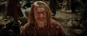 Movie still from “Indiana Jones and the Kingdom of the Crystal Skull” (2008), directed by Steven Spielberg – An old man with long hair and a long beard; Close Up shot, Low angle
