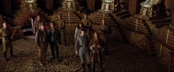 Movie still from “Indiana Jones and the Kingdom of the Crystal Skull” (2008), directed by Steven Spielberg – A group of people standing in front of a wall; Wide shot, High angle