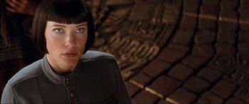 Movie still from “Indiana Jones and the Kingdom of the Crystal Skull” (2008), directed by Steven Spielberg – A person with short black hair; Close Up shot, Over the shoulder angle