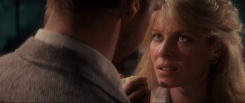Movie still from “Indiana Jones and the Temple of Doom” (1984), directed by Steven Spielberg – A man and a woman looking at one another; Close Up shot, Over the shoulder angle
