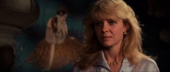 Movie still from “Indiana Jones and the Temple of Doom” (1984), directed by Steven Spielberg – A person wearing a necklace; Close Up shot, Low angle