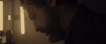 Movie still from “Infiesto” (2023), directed by Patxi Amezcua – A person with a beard; Extreme Close Up shot, Low angle