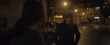 Movie still from “Infiesto” (2023), directed by Patxi Amezcua – Two women standing next to each other on a street; Medium shot, Over the shoulder angle