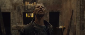 Movie still from “Infiesto” (2023), directed by Patxi Amezcua – A man with his eyes wide open looking up; Close Up shot, Low angle