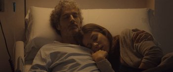 Movie still from “Infiesto” (2023), directed by Patxi Amezcua – A man and a woman laying in bed together; Close Up shot, Low angle