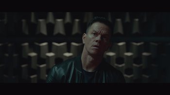 Movie still from “Infinite” (2021), directed by Antoine Fuqua – A person wearing a leather jacket; Close Up shot, Low angle