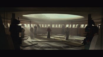 Movie still from “Infinite” (2021), directed by Antoine Fuqua – A group of people standing around in a room; Extreme Wide shot, Low angle