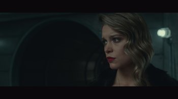 Movie still from “Infinite” (2021), directed by Antoine Fuqua – A beautiful woman with red lipstick looking into the distance; Close Up shot, Low angle