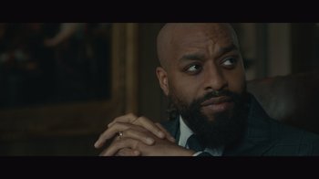 Movie still from “Infinite” (2021), directed by Antoine Fuqua – A man with a beard is looking at the camera; Close Up shot, Low angle