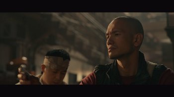 Movie still from “Infinite” (2021), directed by Antoine Fuqua – A man with a bandage on his head and another man with a bandage on his head; Close Up shot, Low angle