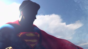 Movie still from “Injustice” (2021), directed by Matt Peters – A man in a superman costume with a sky background; Medium shot, Low angle