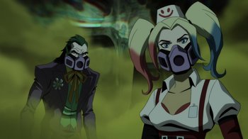 Movie still from “Injustice” (2021), directed by Matt Peters – Two people wearing masks in a green and yellow background; Medium shot, Low angle