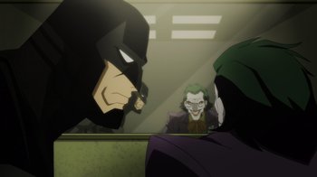 Movie still from “Injustice” (2021), directed by Matt Peters – The joker and the batman in the mirror; Medium shot, Over the shoulder angle