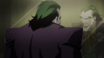 Movie still from “Injustice” (2021), directed by Matt Peters – A man with green hair is looking at another man; Medium shot, Over the shoulder angle