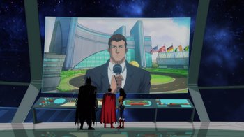 Movie still from “Injustice” (2021), directed by Matt Peters – A group of people standing in front of a large screen; Extreme Wide shot, Over the shoulder angle
