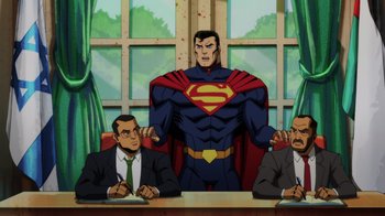 Movie still from “Injustice” (2021), directed by Matt Peters – A man standing in front of two other men in front of a window; Medium shot, Over the shoulder angle